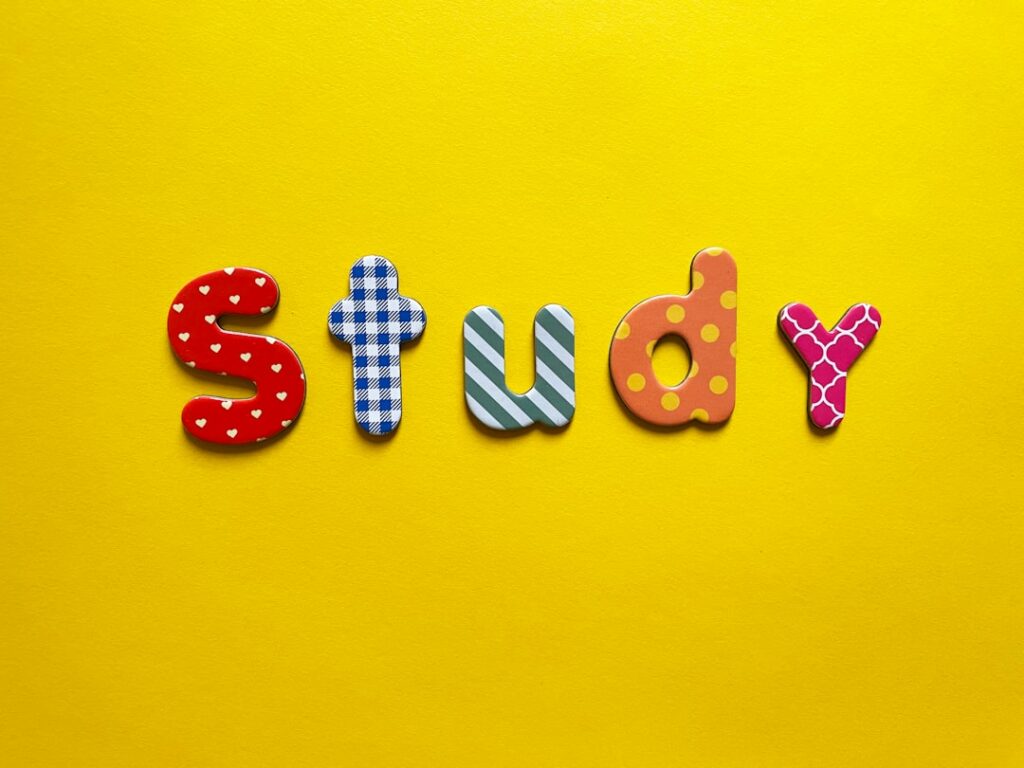 a yellow background with the word study spelled out